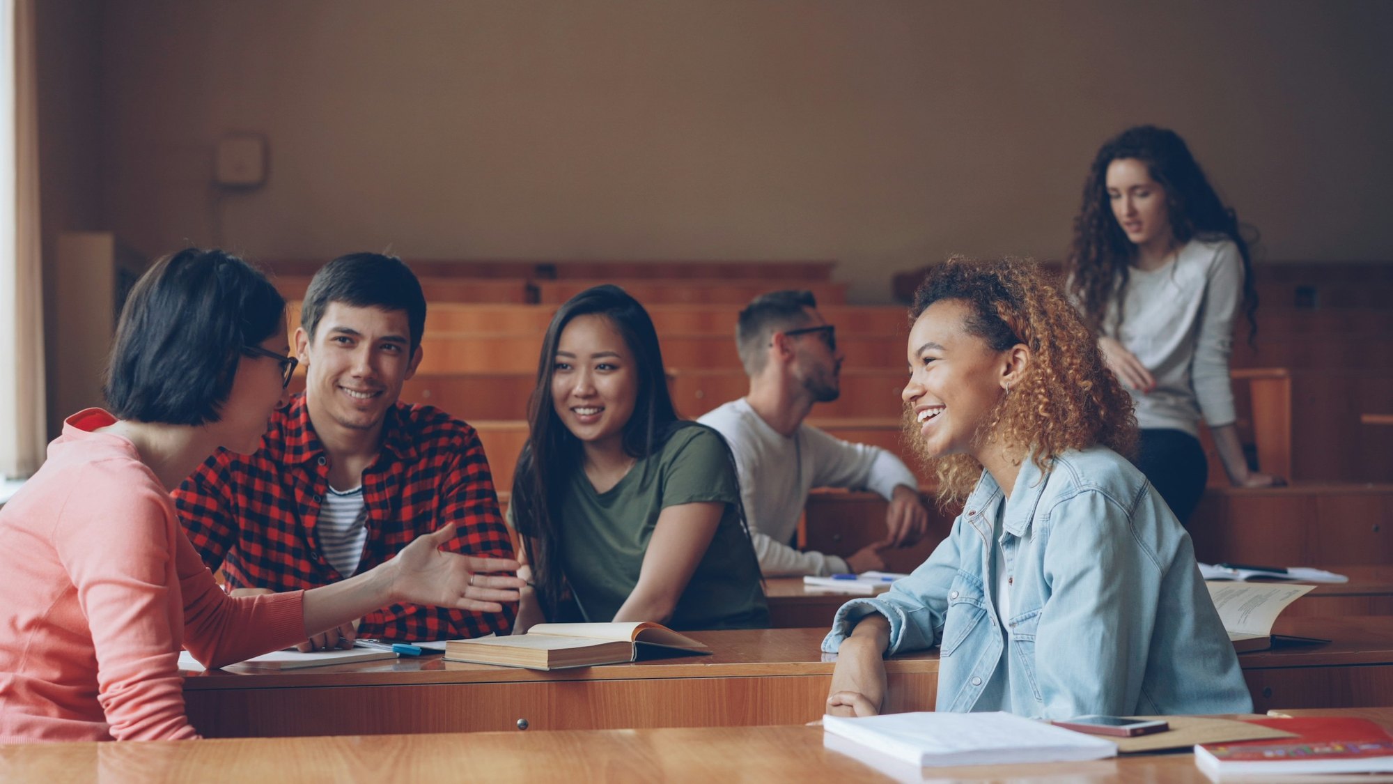 Students talking in a university lecture hall